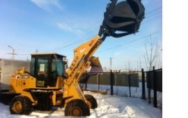 Уборка снега погрузчиком фронтальным