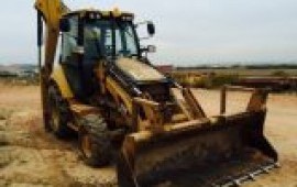 Экскаватор- погрузчик CAT с гидромолотом аренда