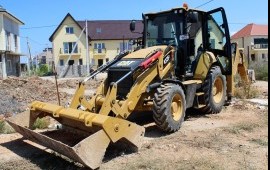 Аренда экскаватора погрузчика с гидромолотом