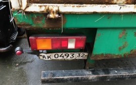 Аренда тягач МАЗ с бортовым полуприцепом без тента в Брянске