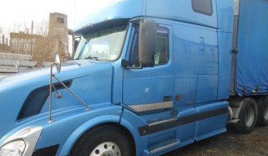 Сцепка Volvo VNL + полуприцеп тентованный schmitz