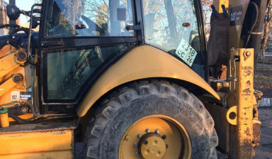 Аренда экскватора - погрузчика. Планировка. caterpillar