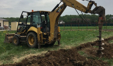 Аренда ямобура JCB. Шнековое бурение.