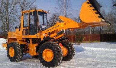 Уборка снега погрузчиком Амкодор 332