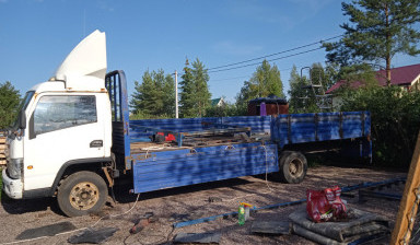 Перевозка грузов на бортовом грузовике.